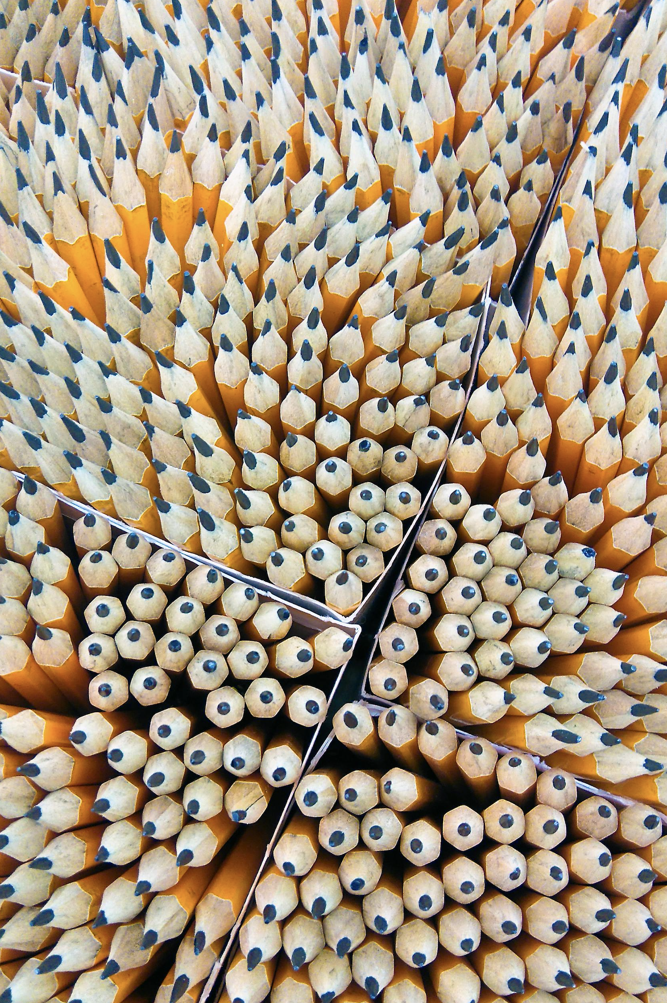 A render of three white cylindrical columns, against a warm creme background
